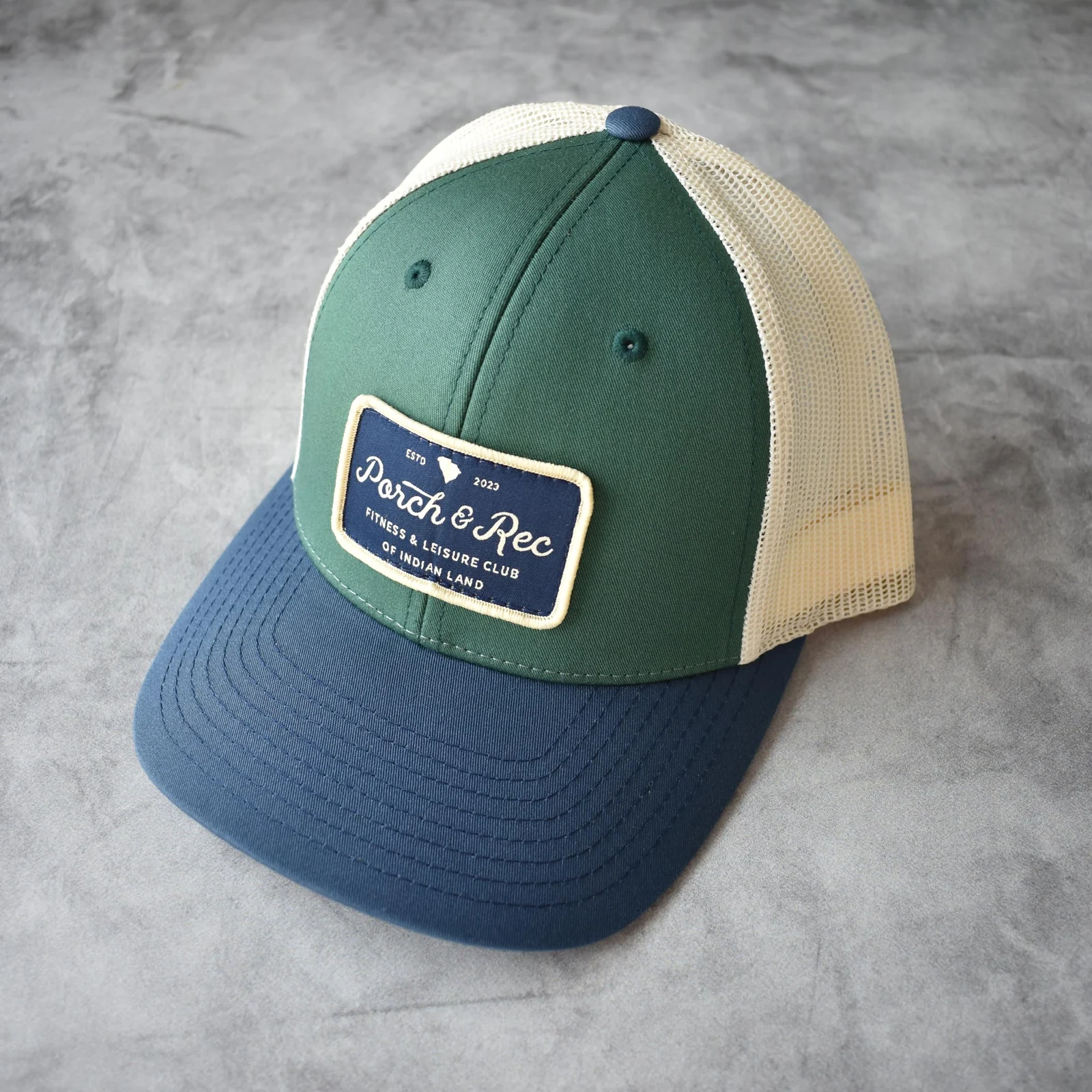 The Club Hat in Forest & navy